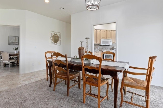 view of carpeted dining area