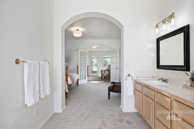 bathroom featuring vanity and french doors