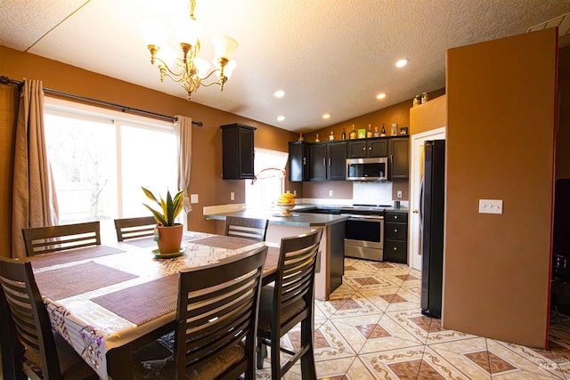 tiled dining room featuring lofted ceiling, a notable chandelier, and a textured ceiling