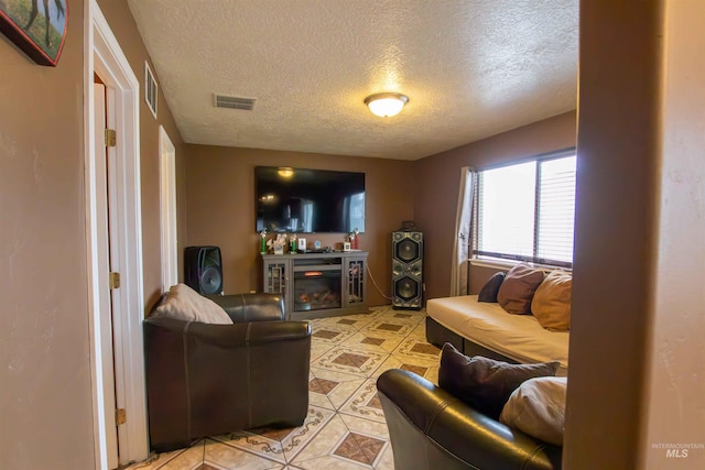 living room featuring a textured ceiling