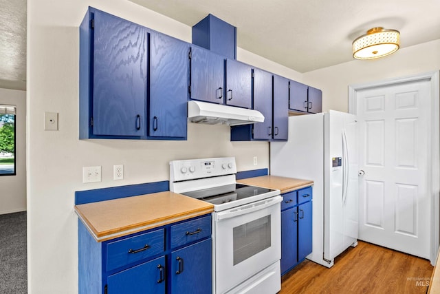 1131 Aztec Dr, Twin Falls, ID 83301 - kitchen featuring under cabinet range hood, white appliances, blue cabinets, and light wood-type flooring