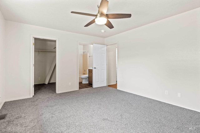 1131 Aztec Dr, Twin Falls, ID 83301 - unfurnished bedroom with carpet, a walk in closet, baseboards, a closet, and ensuite bathroom