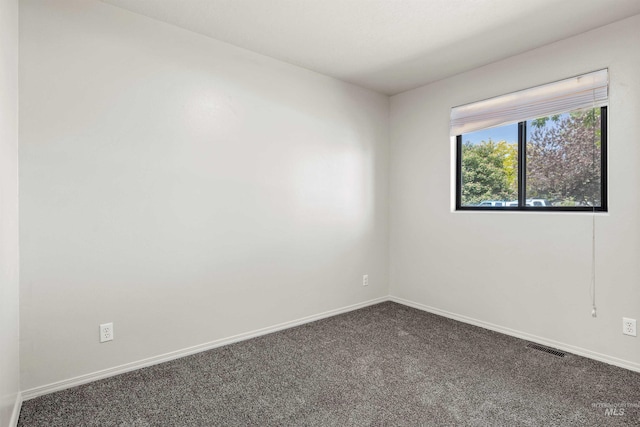 1131 Aztec Dr, Twin Falls, ID 83301 - empty room with dark colored carpet and baseboards