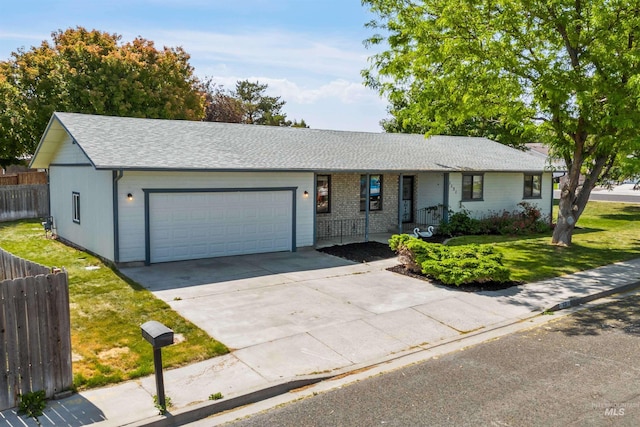 1131 Aztec Dr, Twin Falls, ID 83301 - ranch-style house with an attached garage, concrete driveway, and covered porch