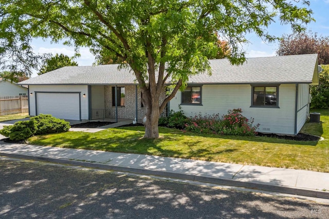 1131 Aztec Dr, Twin Falls, ID 83301 - ranch-style house with an attached garage, central AC unit, and a shingled roof