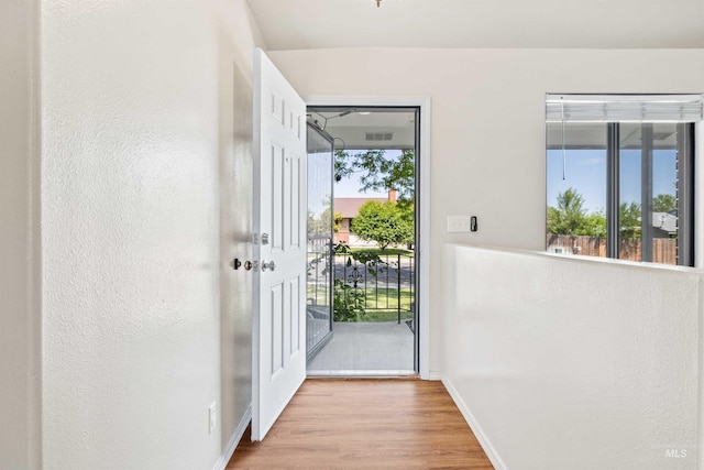 1131 Aztec Dr, Twin Falls, ID 83301 - doorway to outside with wood finished floors, plenty of natural light, and baseboards