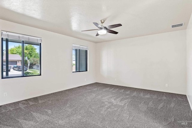 1131 Aztec Dr, Twin Falls, ID 83301 - spare room with dark colored carpet, a ceiling fan, and baseboards