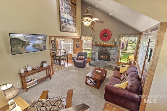 13098 Hillhouse Loop, Donnelly, ID 83615 - living area with a fireplace, carpet floors, ceiling fan, and high vaulted ceiling