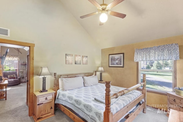 13098 Hillhouse Loop, Donnelly, ID 83615 - bedroom featuring light colored carpet, high vaulted ceiling, ceiling fan, and baseboards