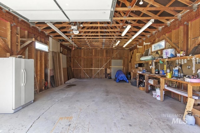 13098 Hillhouse Loop, Donnelly, ID 83615 - garage featuring freestanding refrigerator