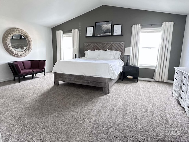 bedroom with carpet and lofted ceiling