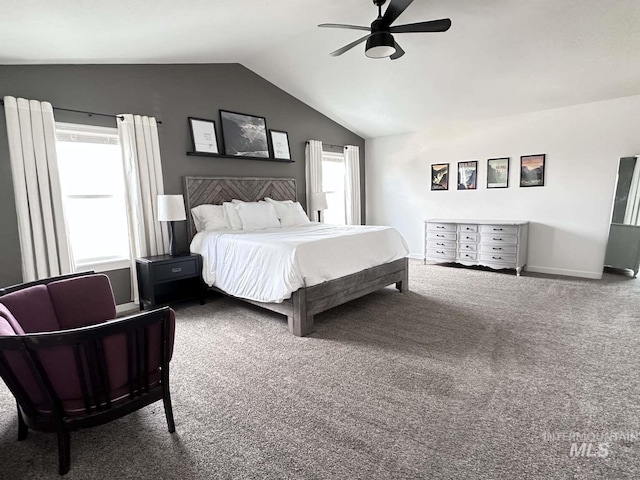 bedroom featuring lofted ceiling, multiple windows, carpet floors, and ceiling fan