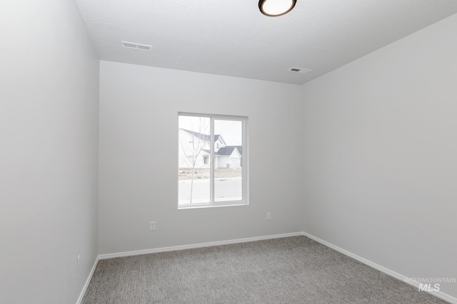 15414 Ivybridge Way, Nampa, ID 83651 - empty room with visible vents, baseboards, and carpet flooring