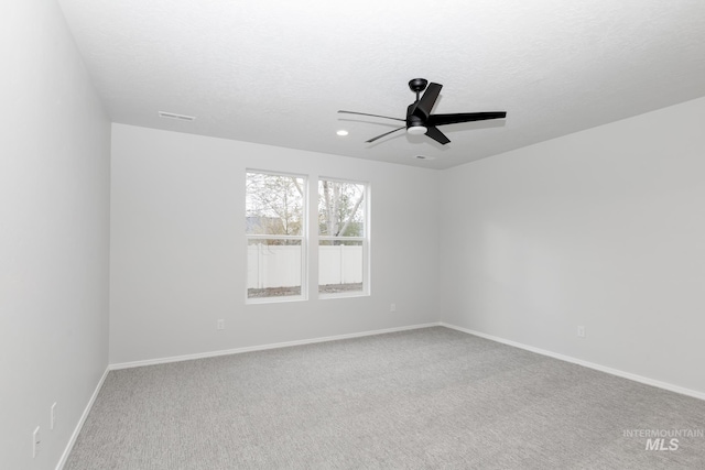 15414 Ivybridge Way, Nampa, ID 83651 - carpeted empty room featuring visible vents, baseboards, a ceiling fan, and a textured ceiling
