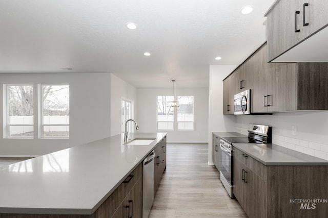 15414 Ivybridge Way, Nampa, ID 83651 - kitchen with recessed lighting, modern cabinets, stainless steel appliances, a large island with sink, and a sink