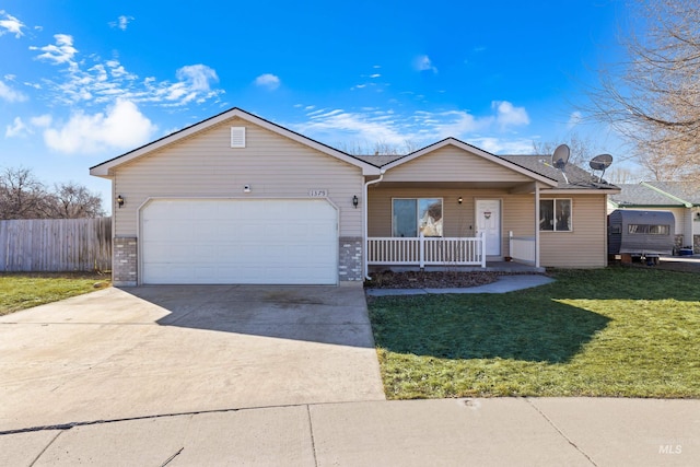 ranch-style house featuring covered porch, an attached garage, a front yard, fence, and driveway