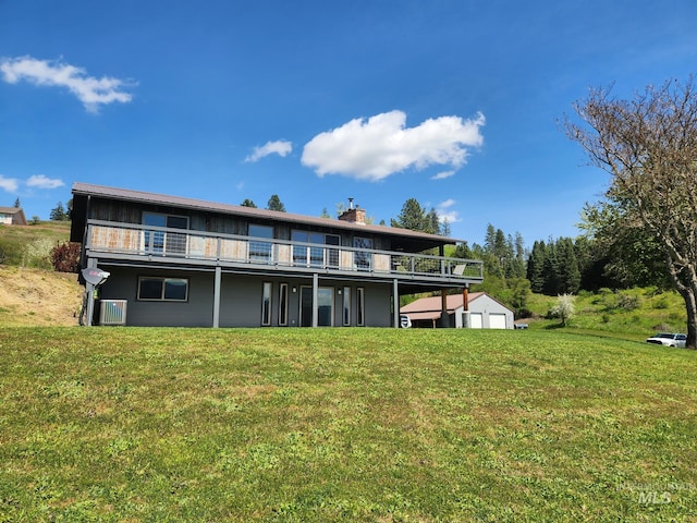 131 Beaver Nob Dr, Kamiah, ID 83536 - rear view of property with a lawn, a chimney, cooling unit, and a deck