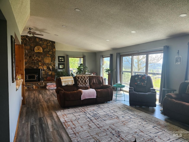 131 Beaver Nob Dr, Kamiah, ID 83536 - living area with a textured ceiling, wood finished floors, lofted ceiling, and a ceiling fan