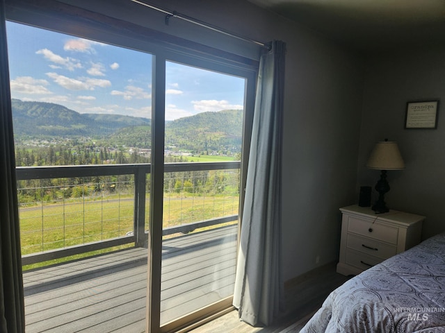 131 Beaver Nob Dr, Kamiah, ID 83536 - bedroom featuring a mountain view and wood finished floors