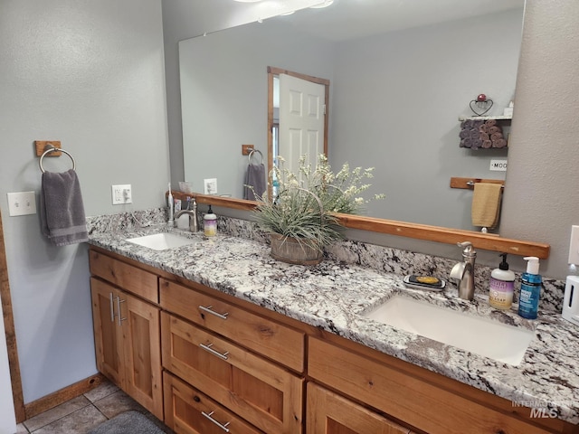 131 Beaver Nob Dr, Kamiah, ID 83536 - bathroom featuring double vanity and baseboards