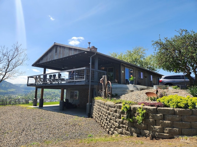 131 Beaver Nob Dr, Kamiah, ID 83536 - view of home's exterior with a wooden deck and a chimney