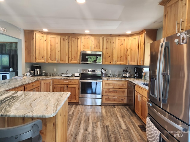 131 Beaver Nob Dr, Kamiah, ID 83536 - kitchen featuring stainless steel appliances, light wood finished floors, recessed lighting, light stone countertops, and light brown cabinetry