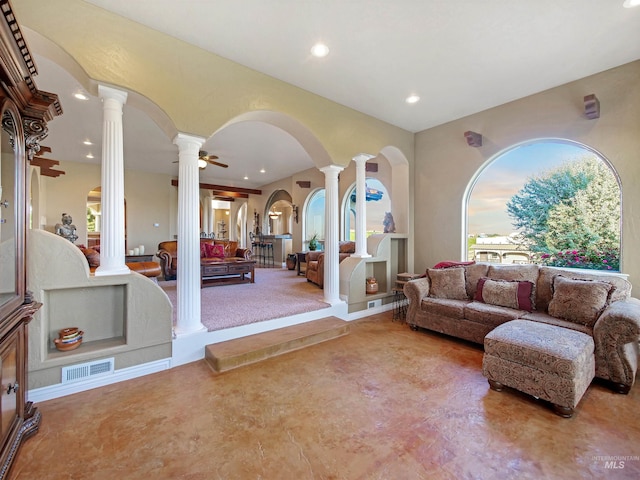 16480 Goodson Rd, Caldwell, ID 83607 - carpeted living room featuring plenty of natural light, ceiling fan, and decorative columns