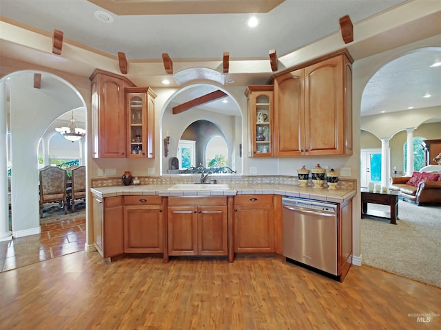 16480 Goodson Rd, Caldwell, ID 83607 - kitchen with light hardwood / wood-style flooring, sink, tile countertops, and dishwasher