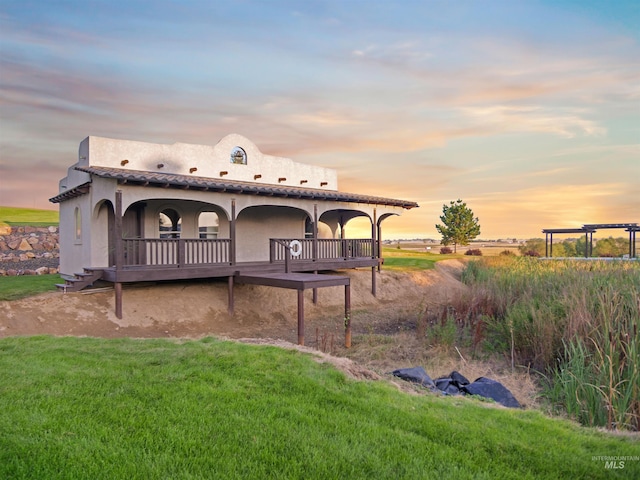 16480 Goodson Rd, Caldwell, ID 83607 - back house at dusk featuring a lawn