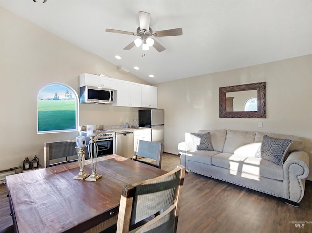 16480 Goodson Rd, Caldwell, ID 83607 - dining room featuring vaulted ceiling, ceiling fan, sink, and dark hardwood / wood-style floors