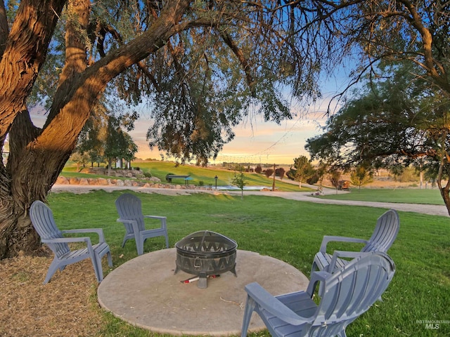 16480 Goodson Rd, Caldwell, ID 83607 - yard at dusk featuring an outdoor fire pit