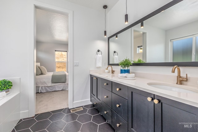 bathroom with vanity and tile patterned floors