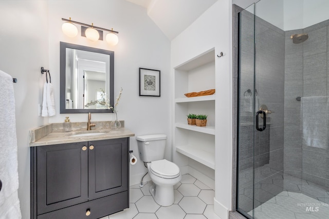 bathroom featuring vanity, walk in shower, lofted ceiling, tile patterned flooring, and toilet