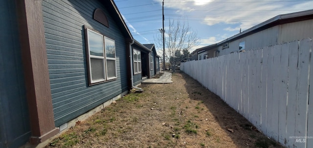 view of home's exterior featuring fence