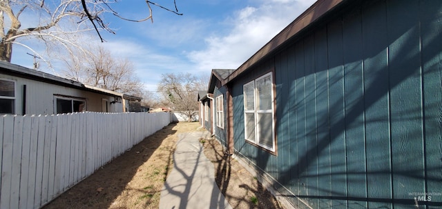 view of side of property with fence