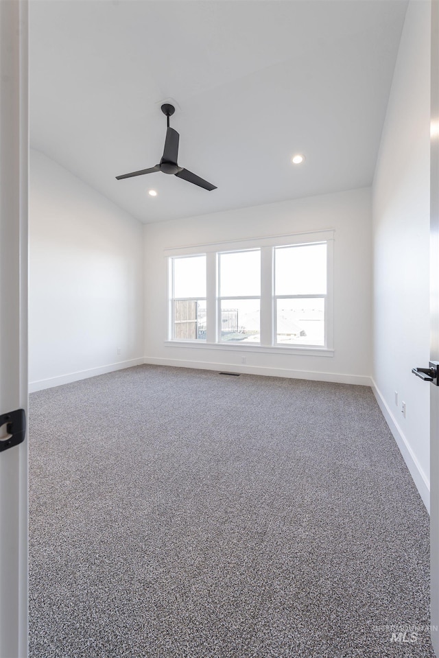 carpeted empty room with ceiling fan, visible vents, baseboards, and recessed lighting