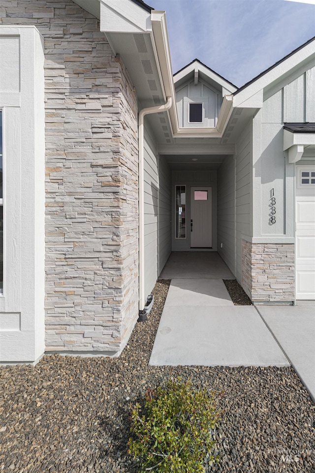 doorway to property with stone siding