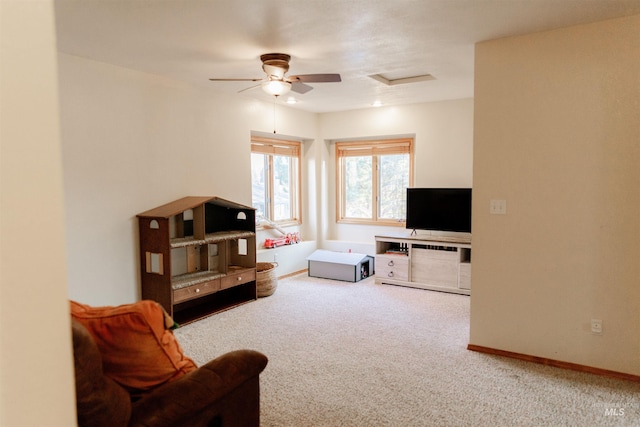 living room featuring ceiling fan and carpet floors