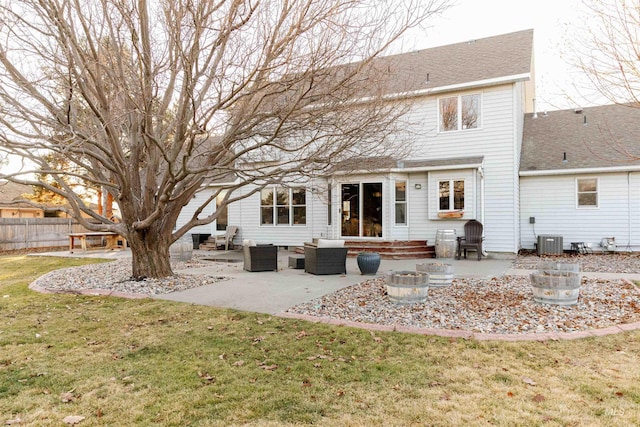 back of property with outdoor lounge area, central AC unit, a yard, and a patio