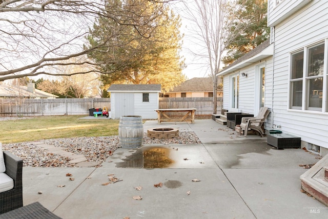 view of patio / terrace featuring a storage unit and an outdoor fire pit