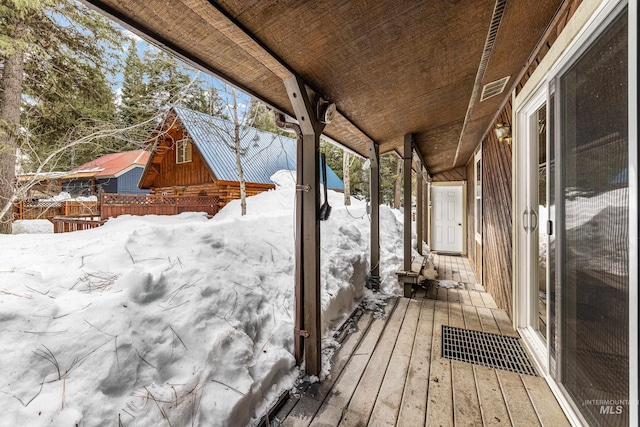 view of snow covered deck