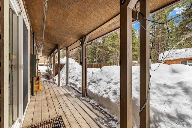 view of snow covered deck