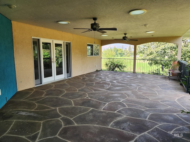 view of patio with ceiling fan and french doors