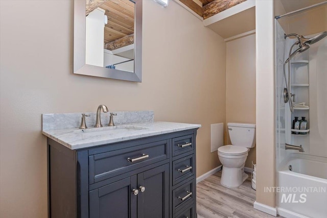 full bathroom with hardwood / wood-style flooring, shower / washtub combination, vanity, and toilet