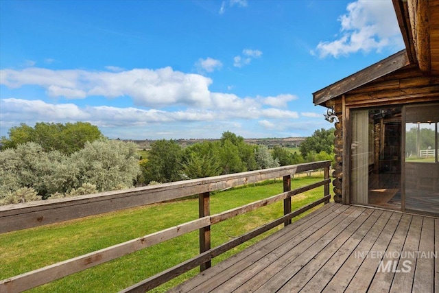 wooden terrace with a yard