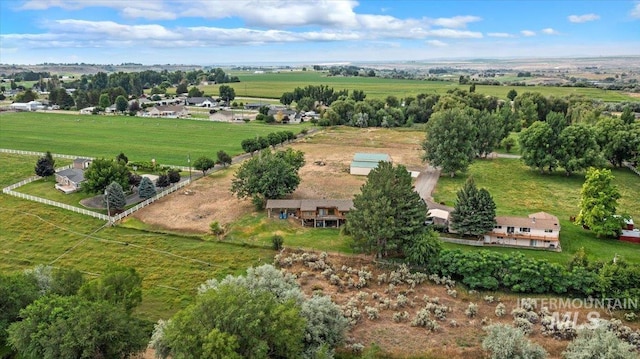 birds eye view of property with a rural view