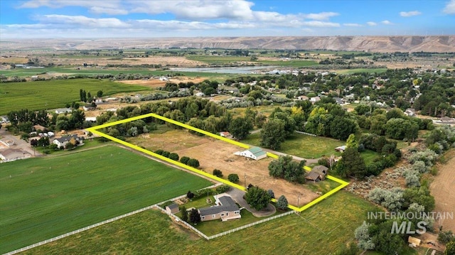 drone / aerial view featuring a mountain view and a rural view