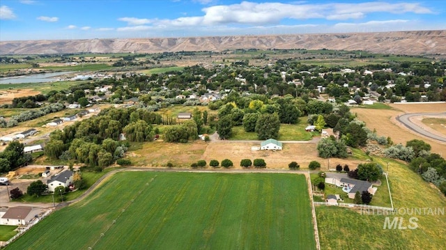 bird's eye view with a rural view and a water and mountain view