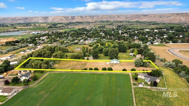 aerial view featuring a water and mountain view