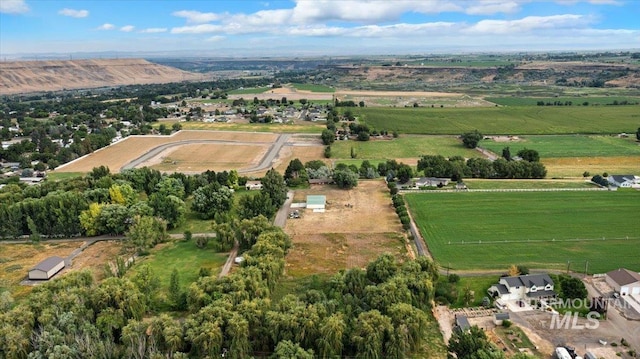 birds eye view of property with a rural view